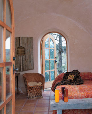 
Through a dual set of doors, the desert air of the outside reaches the snug one-room adobe building adjacent to Dyanna’s main cabin.
